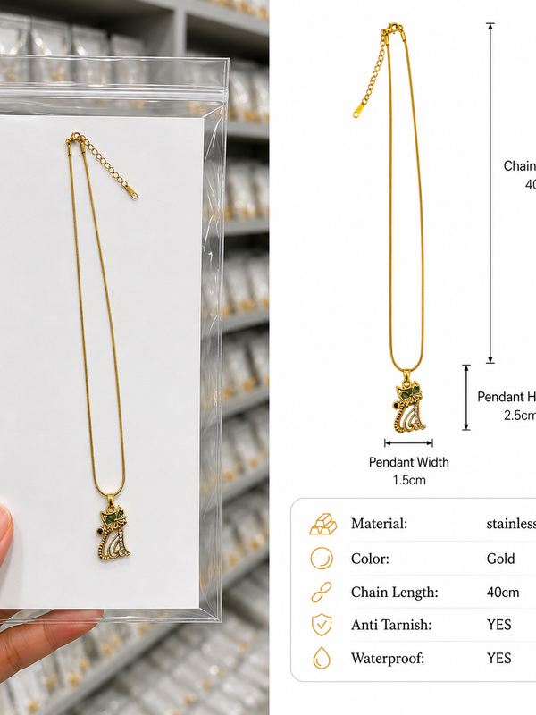 A gold-toned stainless steel pendant necklace with a small cat figure, shown hanging on a white card inside a clear plastic sleeve, held by a hand on the left, and a dimension diagram on the right showing chain length 40cm and pendant height details.